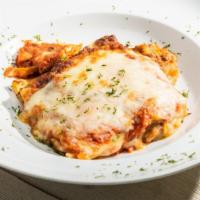 Lasagna Al Forno · Homemade lasagna layered with bolognese and bechamel. Fresh pomodoro and melted mozzarella c...