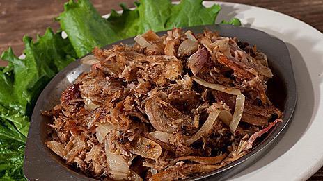 Lechon Asado Con Cebolla · Tender pieces of roast pork, pulled and grilled with fresh sautéed onions and a touch of havana’s signature mojo sauce.