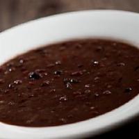 Sopa De Frijoles Negros · Our famous black beans slowly simmered and seasoned with fresh ground garlic, onions, pepper...