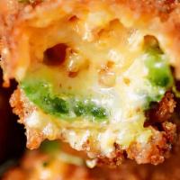Jalapeno Poppers · 8 crispy jalapeno poppers filled with Cheddar cheese