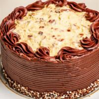 German Chocolate Cake · Rich chocolate cake layered and filled with toasted coconut pecan filling. finished with a s...