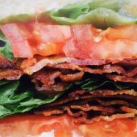 L.T. Club · Six strips of bacon, lettuce, tomato, and mayo stacked on three slices of toast.