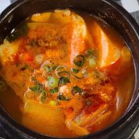 Soft Tofu · Soft tofu stew with seafood and vegetables. 
Choose Spicy or white.