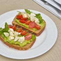 Avocado Toast · 2 slices of white bread toasted with avocado, cilantro, olive oil, tomatoes slices and spinach