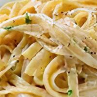 Fettuccini Alfredo · Include pasta, salad and garlic knots.