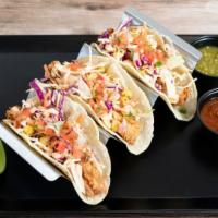 Shrimp Tacos · Shrimps are lightly fried and serve with Mix of Green and Purple Cabbage, Corn, Pica de Gall...