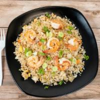 Shrimp Fried Rice · Sautéed Shrimp  Serve with Peas and Carrots, Onion, Scallions, Egg and Thai Jasmine Rice