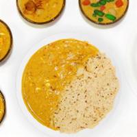 Punjabi Kadhi *F* · Protein of your choice marinated in a tangy sauce with yogurt and chickpea-flour. Spice Leve...