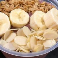 Acai Bowl - Peanut Butter Blend · Organic and unsweetened acai bowl, blended with peanut butter and topped with bananas, grano...