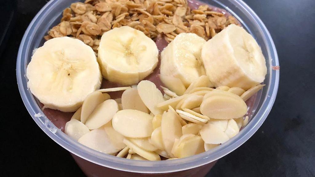 Acai Bowl - Peanut Butter Blend · Organic and unsweetened acai bowl, blended with peanut butter and topped with bananas, granola and almonds
