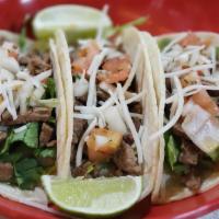 Vegan Steak Tacos · 3 tacos filled with vegan chopped steak, pico de gallo (salsa criolla) and lettuce. served w...