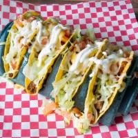 Taco Supremos · Four crunchy tacos with ground beef, lettuce, tomatoes, sour cream and shredded cheese.