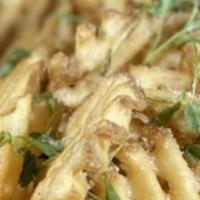Truffle Fries · Shoestring French Fries Tossed in Truffle Oil and Parmesan Cheese