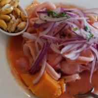 Ceviche Clasico · Fresh fish cured in lemon juice with onions, coriander and pepper.