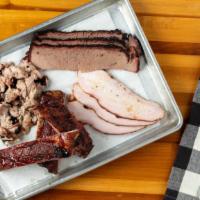 Sampler Platter · Four meats, three sides, two drinks and two pieces of texas toast.