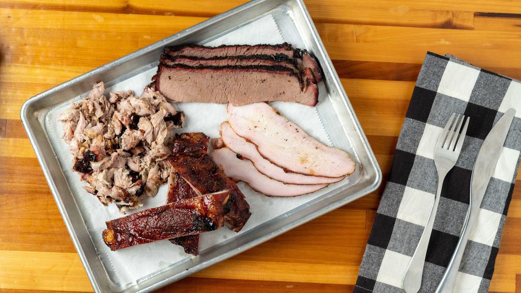 Sampler Platter · Four meats, three sides, two drinks and two pieces of texas toast.