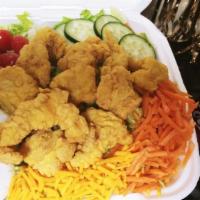 Catfish Salad · Enjoy This DELICIOUS Crispy Catfish Topped Salad With Crisp Lettuce, Cheese, Tomato, Cucumbe...