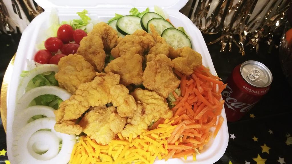 Catfish Salad · Enjoy This DELICIOUS Crispy Catfish Topped Salad With Crisp Lettuce, Cheese, Tomato, Cucumber, Onions, and Carrots. With your  Choice of Dressing: Caesar, Italian, Ranch, Thousand Island