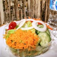 Garden Salad · Crispy fresh lettuce topped with cheese, onion, tomatoes, cucumbers and carrots. Add your ch...
