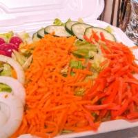 Large Garden Salad · Lettuce, Cheese, Tomato, Cucumber, Onions, Carrots. Choice of: Chicken, Shrimp, Bacon, Catfi...