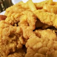 Catfish Nuggets Served W/Fries · Delicious mouthwatering catfish nuggets served with crispy golden fries and hush puppies wit...