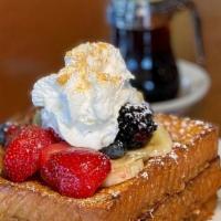 Captain Crunch French Toast · Challah bread dipped in our almond French toast batter. Topped with strawberries, blackberri...