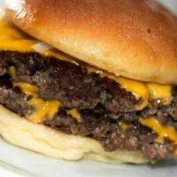 Fat Fat Burger · Two homemade beef patties with house seasoning and Cheddar cheese on a sesame seed bun.