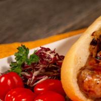 Meaty Beef Polish · Beef Polish sausage topped with onions, peppers and mustard served on a potato bun