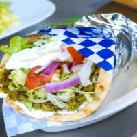 Grilled Falafel · Vegetarian. Chickpeas, parsley, garlic, and herbs blended together, formed into patties, and...