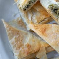 Spanakopita · Vegetarian. Spinach pie. Layers of a light crispy phyllo, filled with seasoned spinach and f...