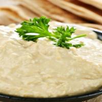 Garlic Hummus · Vegan. Chickpeas blended into a creamy consistency with freshly chopped garlic, olive oil, a...