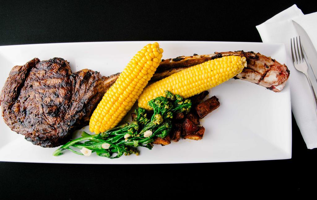 32 Oz Tomahawk Steak  · Hand Cut Certified Angus Beef, Dinner for 2.
Sides Included