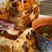 Birria Burrito · Flour tortilla, stuffed with refried beans, mexican rice, mix cheese, meat/ brisket, oxtail ...