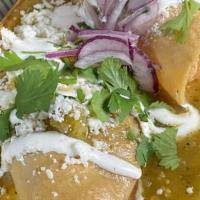 Mexican Chorizo Enchiladas · 3 enchiladas served with mexican rice, refried beans, salsa verde and queso fresco. Garnishe...