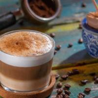 Cappuccino · Single espresso shot and hot milk, with the surface topped with foamed milk and cinnamon pow...