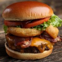 Butch’S Wild Bbq Burger · Butch’s Wild BBQ Burger - 1/2 pound burger*, BBQ sauce, cheddar cheese, bacon, onion rings, ...