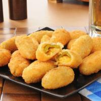 Jalapeño Poppers · Battered and deep-fried jalapeños filled with melted cheese.