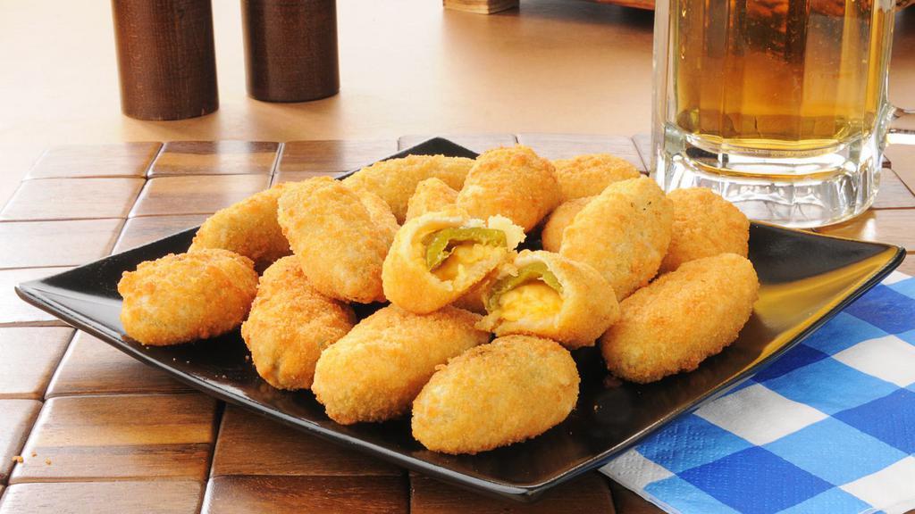 Jalapeño Poppers · Battered and deep-fried jalapeños filled with melted cheese.