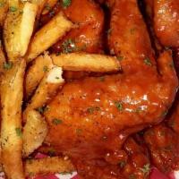 4 Whole Wings · Served with fresh-cut fries and choice of sauce. Includes fries and sauce.