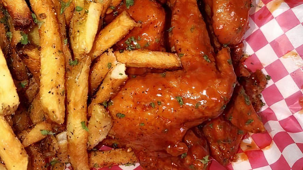 4 Whole Wings · Served with fresh-cut fries and choice of sauce. Includes fries and sauce.
