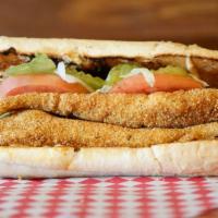Catfish Po-Boy · Served on fresh French bread, crispy lettuce, pickles, tomatoes, and housemade remoulade sau...