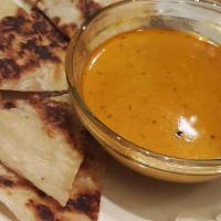 Roti Canai · Mild hot and spicy. Malaysia Indian style pan-fried pancake served with curry sauce for dipp...