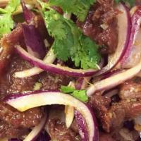 Yum Nurr (Spicy Beef Salad) · Mild hot and spicy. Grilled marinated beef mixed with lime juice, cucumber, tomato, onion, m...