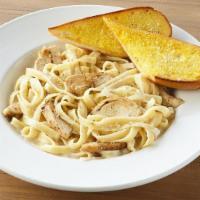 Chicken Fettuccine Alfredo · Grilled chicken breast chopped and served with fettuccine noodles, bacon & creamy Alfredo sa...