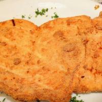 Chuleta De Pollo · Breaded chicken breast.