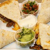 Quesadillas De Pollo · Chicken quesadilla. Chicken grilled at the moment and melted monterrey jack cheese. Pico de ...