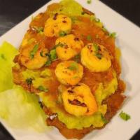 Patacon Con Camarones · Fried green plantain with shrimp.