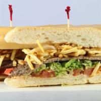 Pan Con Bistec Sandwich · Steak sandwich. Lettuce, tomato, sautéed onions, chips, and mayonnaise.