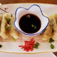 Chicken Pot Stickers · 6 chicken dumplings grilled on hot teppan grill to get a nice crispy bottom.
