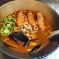 Spicy Seafood Ramen · Rich and spicy seafood broth with large easy peel headless shrimp, mussels, kamaboko (Japane...